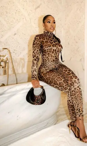 Yung Miami wearing Dolce & Gabbana suit