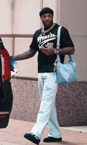 PJ Tucker’s Outfit in Amiri T-Shirt, Nike Sneakers & Loewe Bag (2023)