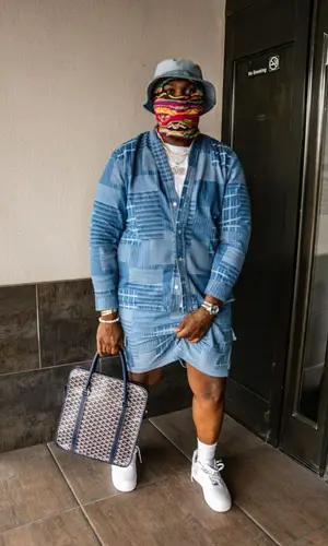 Peezy wearing Kith shirt