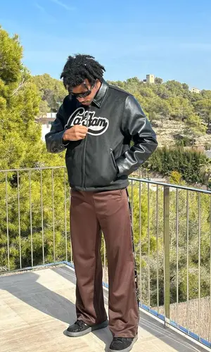 Jules Kounde’s Outfit in La Fam Jacket, Kapital Pants & Oakley Eyewear (2023)