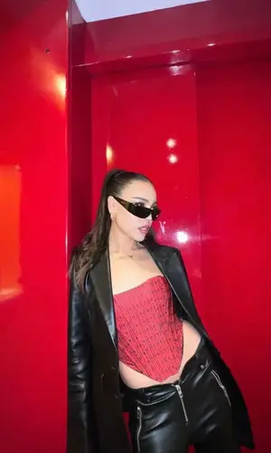 Danna Paola wearing Versace boots