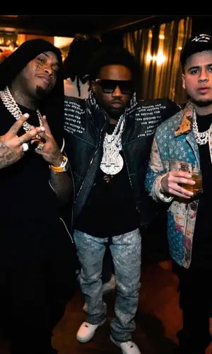 Roddy Ricch’s Outfit in Who Decides War Jacket, Earthling VIP Jeans & Nike Sneakers (2023)
