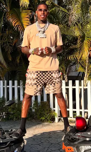 CoreySSG wearing Burberry shorts