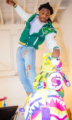 OMB Peezy wearing Alexander McQueen sneakers