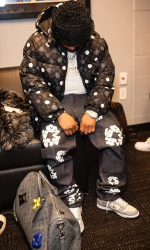 Don Q’s Outfit in Louis Vuitton Jacket, Denim Tears Jeans & Nike Sneakers (2023)