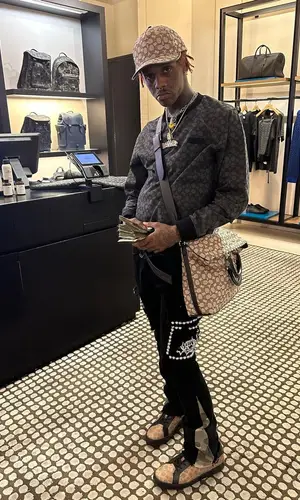 Famous Dex wearing Coach bag