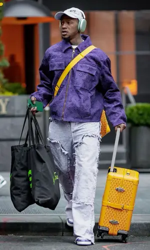 Terry Rozier’s Outfit in Goyard Bag, Louis Vuitton Cap & Apple (2023)