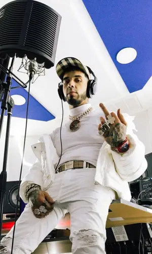 Anuel AA wearing Burberry hat