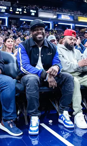 50 Cent’s Outfit in Amiri Jacket, Louis Vuitton Sneakers & New Era Cap (2023)