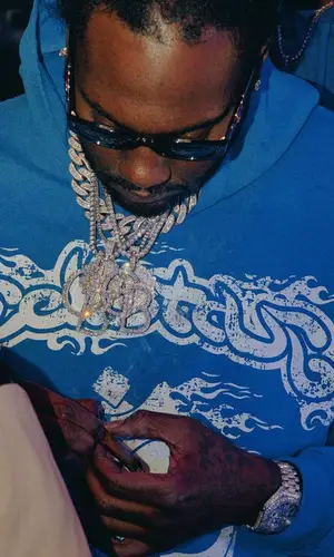 Peezy wearing Hellstar pants