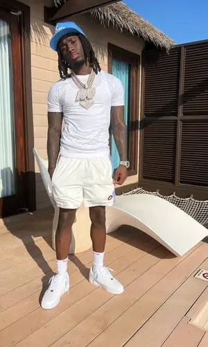 Kai Cenat’s Outfit in Casablanca Shorts, Chrome Hearts Cap & Supreme Socks (2023)