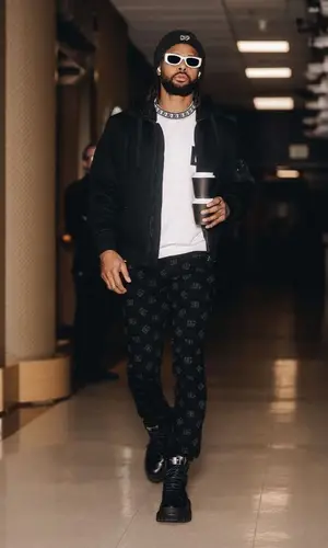 Patty Mills wearing Dolce & Gabbana t-shirt