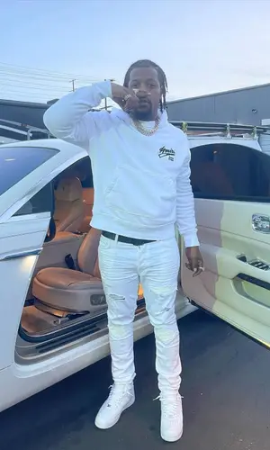 Rowdy Rebel’s Outfit in Amiri Hoodie, Nike Sneakers & Louis Vuitton Belt (2023)