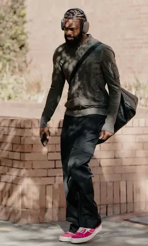 Jaylen Brown’s Outfit in Rick Owens Jacket, Louis Vuitton Bag & Apple (2023)