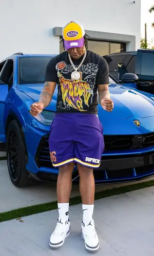 Fredo Bang’s Outfit in Warren Lotas T-Shirt, Von Dutch Cap & Bape Socks (2023)