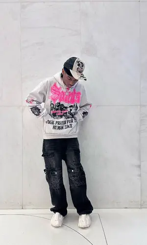 Yvngxchris’ Outfit in Saints World Hoodie, Half Evil 333 Jeans & Vivienne Westwood Jewelry (2023)