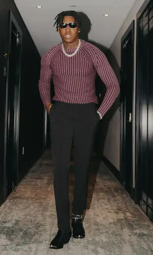 Yung Bleu’s Outfit in Saks Potts Sweater, Celine Boots & Jacques Marie Mage Eyewear (2023)