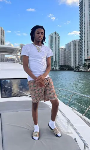 Lil Darius wearing Burberry sandal