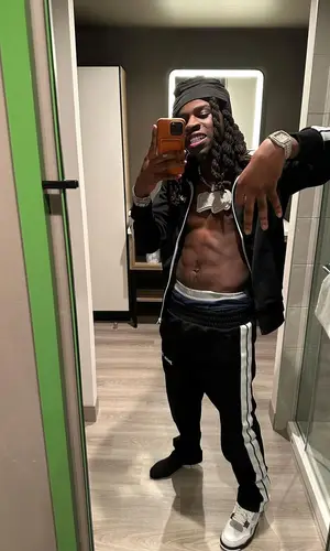 SleazyWorld Go wearing Palm Angels pants