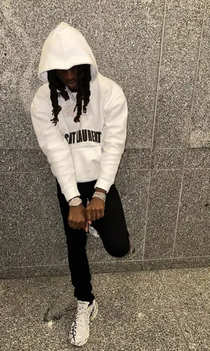 SleazyWorld Go wearing Saint Laurent hoody