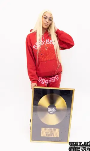 Murda B wearing Spider Worldwide pants