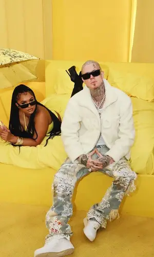 Millyz wearing Who Decides War jacket