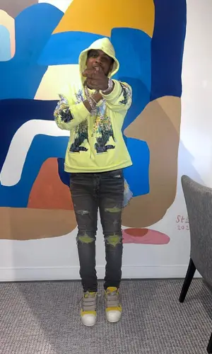 Baby Money wearing Amiri jeans
