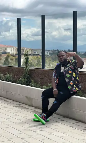 Tee Grizzley wearing Prada shirt