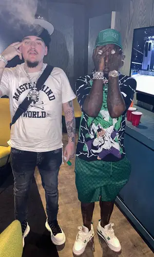 Sauce Walka wearing Hoes Mad LA hat