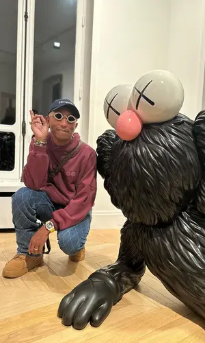 Pharrell Williams wearing Louis Vuitton bag