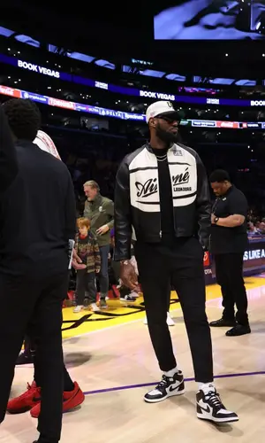 LeBron James’ Outfit in Aime Leon Dore Jacket, Nike Sneakers & Uninterrupted Cap (2023)