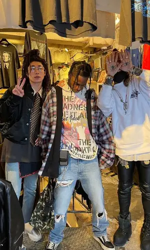 Travis Scott wearing Takashi Murakami belt