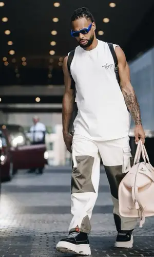 Patty Mills’ Outfit in Round Two Pants, Naked Wolfe Boots & Prada Eyewear (2023)