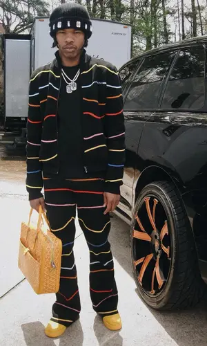 Lil Baby wearing Marni trousers
