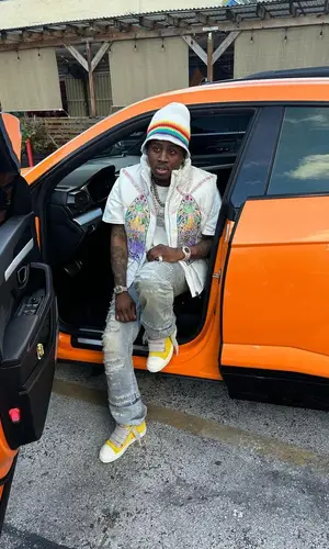 Real Boston Richey wearing Loewe hat