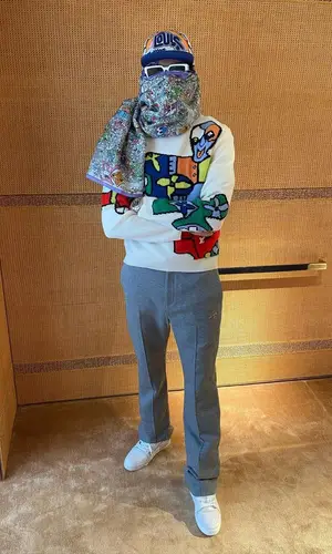 Meekz wearing Louis Vuitton sneakers