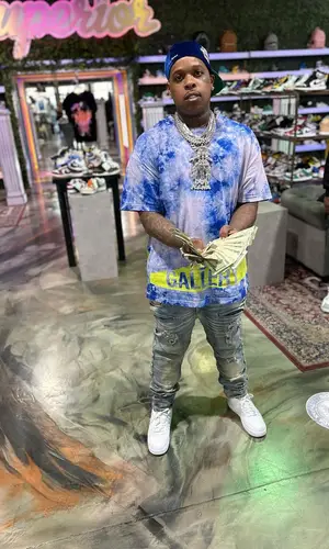 Finesse2tymes wearing Gallery Dept. t-shirt