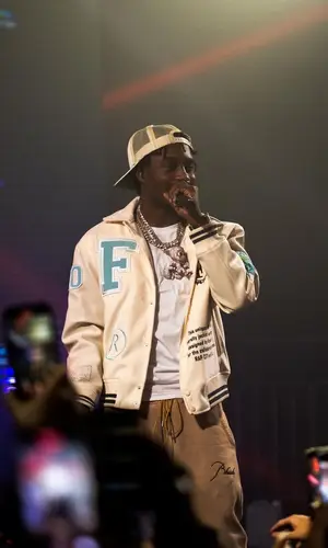 Lil Tjay wearing Finelli jacket