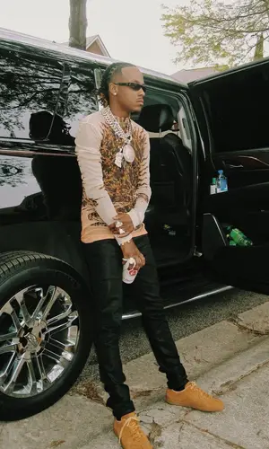 Rich The Kid wearing Givenchy top
