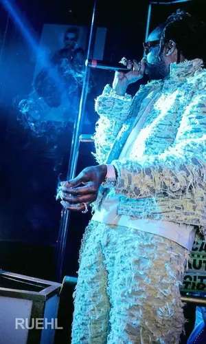 2 Chainz wearing Who Decides War jacket
