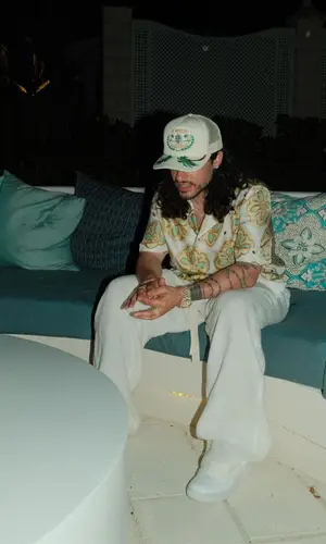 Russ wearing Rhude cap