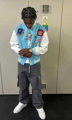 Lil Tjay wearing Yayoi Kusama jacket
