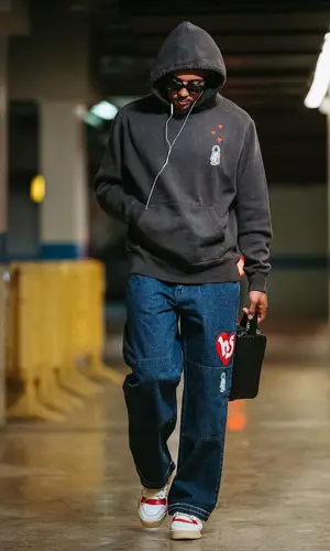 Jules Kounde’s Outfit in Hndsght Hoodie, Adidas Sneakers & Bottega Veneta Bag (2023)