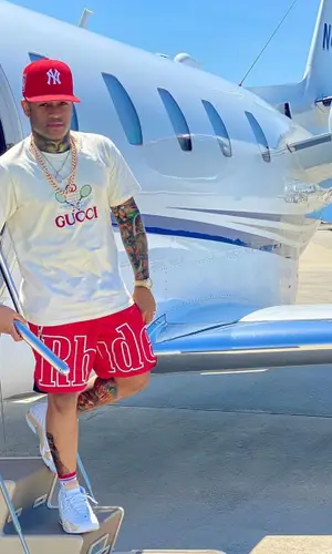 Conceited wearing Rhude shorts