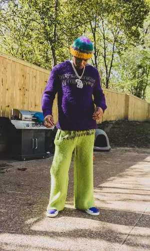 Lil Migo wearing Awful Lot of Cough Syrup sweater