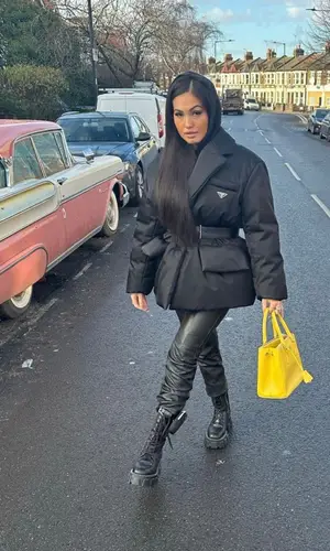 Mabel wearing Prada boots