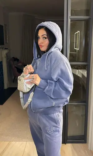 Mabel wearing Chanel sneakers