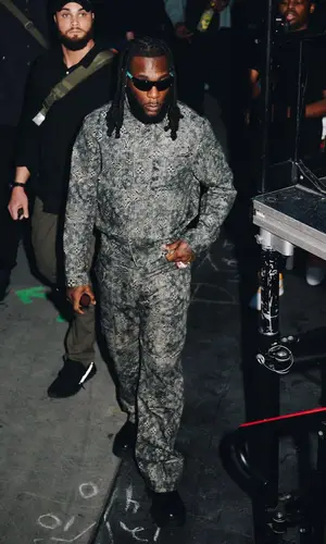 Burna Boy wearing Louis Vuitton belt