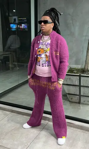 Lil Gotit wearing Awful Lot of Cough Syrup jacket