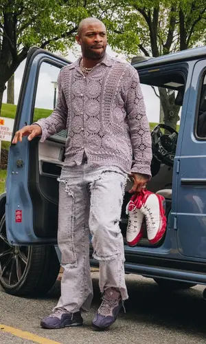 PJ Tucker wearing Louis Vuitton jeans